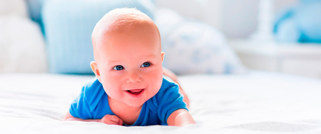 Smiling baby crawling.