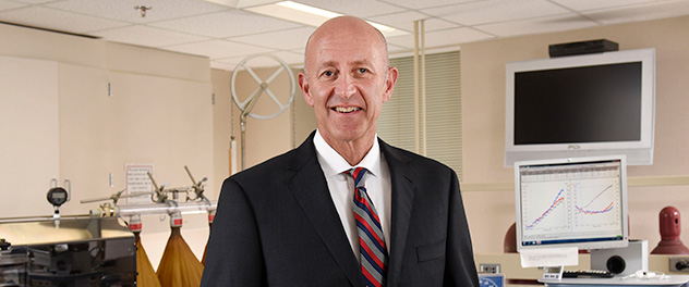 A photograph showing Mayo Clinic researcher Michael J. Joyner, M.D., standing in his lab