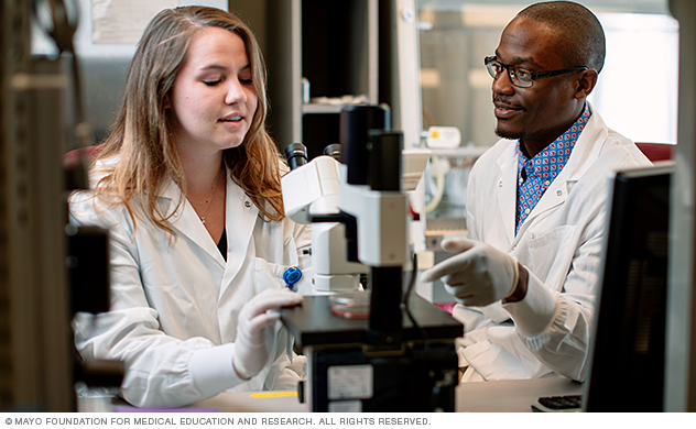 Trainees reviewing microscopy