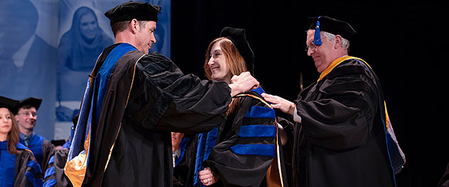 Students and faculty members at graduation