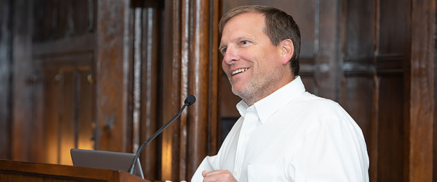 Daniel D. Billadeau, Ph.D., speaks at a podium.