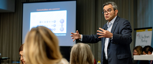 Picture of Dr. Victor M. Montori, M.D., leading a discussion about health care solutions