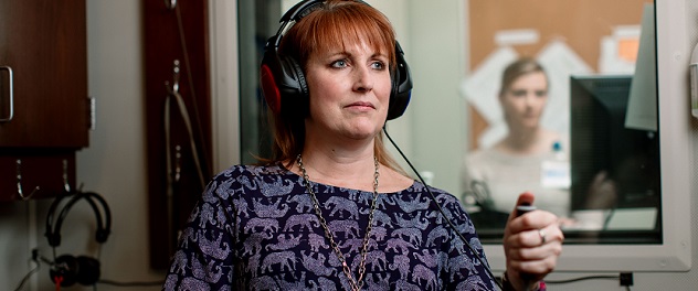 Patient in hearing test booth