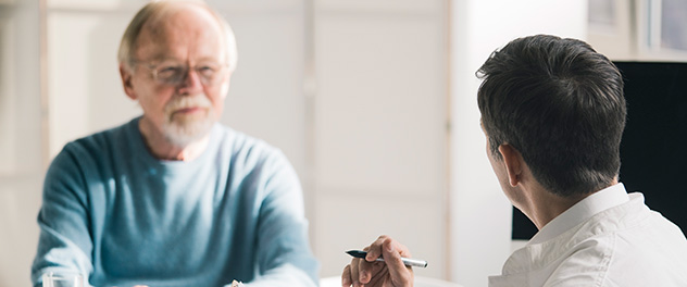 Male patient and doctor in office