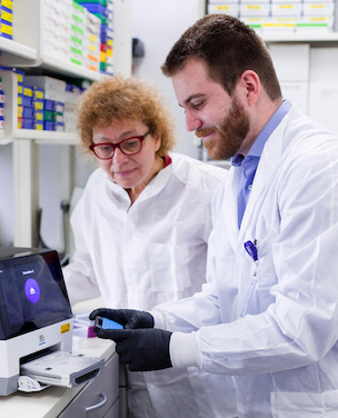 Two investigators working in a lab