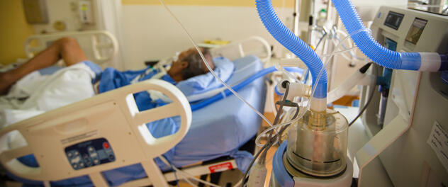 Photograph showing a patient in a hospital bed surrounded by medical equipment for the research lab of Krzysztof Laudanski, M.D., Ph.D., at Mayo Clinic