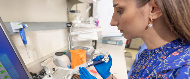 A graduate student assesses DNA quality.